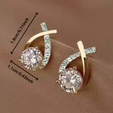 Stud earrings with golden cross and zirconia